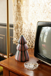 Cinnamon & Clove tree candle styled beside a vintage television