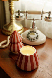 Lit Pink Peppermint candle with lid off